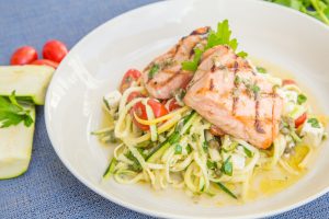 Grilled Salmon Over Squash Salad on White Plate with Boabab-Mustard Dressing | Vitacost.com/blog