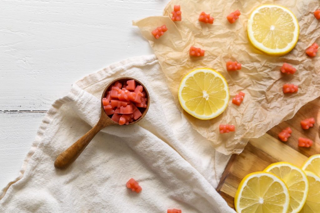 Homemade Strawberry Lemonade Gummy Bears on White with Lemon Slices | Vitacost.com/blog
