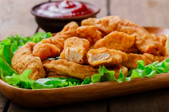 Chicken Tenders Coated in Coconut Flour on Plate with Greens | Vitacost.com/blog