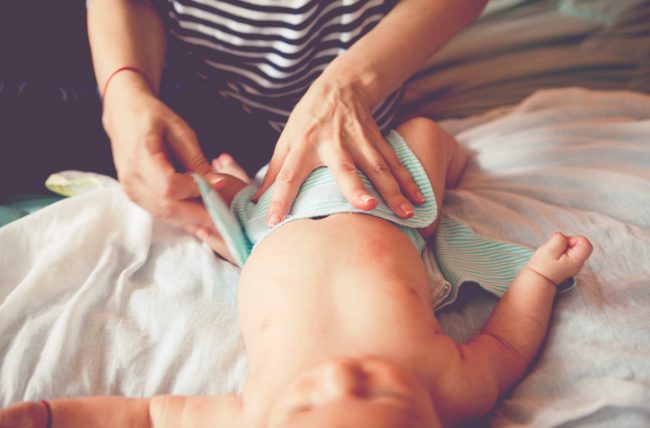 New Mom Leaning How to Cloth Diaper Her Baby | Vitacost.com/blog