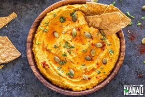 Homemade Spiced Pumpkin Hummus Garnished with Pumpkin Seeds and Served with Tortilla Chips | VItacost.com/Blog
