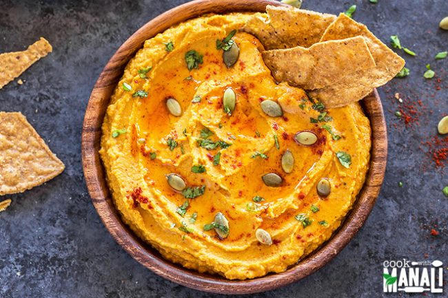 Easy Pumpkin Spice Hummus Recipe Homemade Spiced Pumpkin Hummus Garnished with Pumpkin Seeds and Served with Tortilla Chips | VItacost.com/Blog