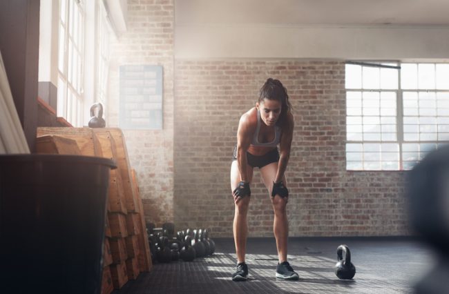 Workout Tips: How to Know When to Stop Woman at Gym Fatigued During Workout | Vitacost.com/Blog
