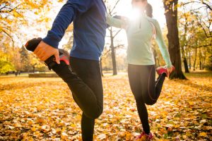 Couple Exercising in Park to Fight Slow Metabolism in Middle Age | Vitacost.com/blog