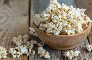 Wooden Bowl Filled With Popcorn on Wooden Table | Vitacost.com/blog