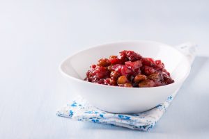 Apple-Cranberry Chutney Recipe in a White Dish on Blue Patterned Napkin | Vitacost.com/blog