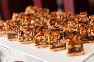 Pecan pie squares on a white platter