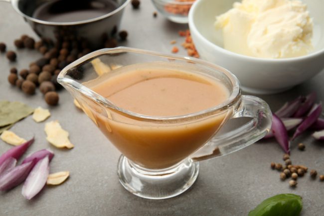 Vegan Gravy Recipe in Glass Sauce Boat Next to Mashed Potatoes | Vitacost.com/blog