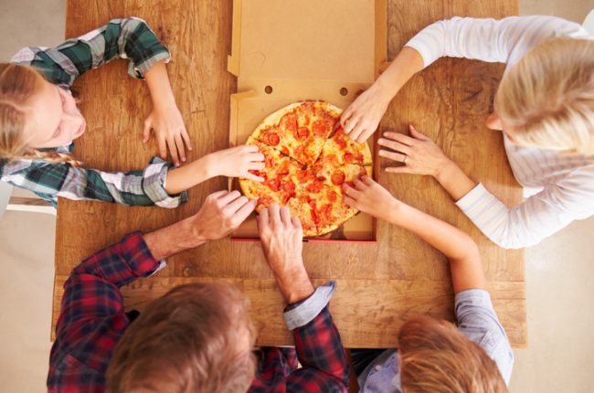 Overhead View of Family Enjoying Healthy Pizza on Pizza Night | Vitacost.com/blog