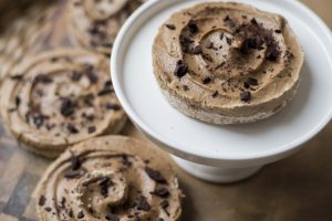 Mini Coffee Cream Pies with Dark Chocolate Pieces – One on White Cake Stand Plus More in Background | Vitacost.com/blog