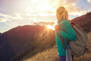 Woman Enjoying the Benefits of Hiking at Sunset on a Mountain | Vitacost.com/blog