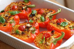 Six Roasted Red Vegan Stuffed Peppers in White Casserole Dish | Vitacost.com/blog