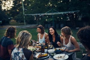 A Group of Friends Enjoying an Eco-Friendly Holiday Party Outdoors | Vitacost.com/Blog