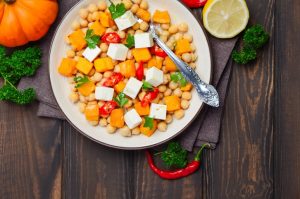 Autumn Chickpea Salad with Squash on White Plate on Wood | Vitacost.com/blog