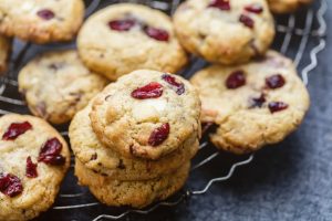 Gluten-Free Holiday Cookies with Cranberries in Stacks on a Plate | Vitacost.com/blog