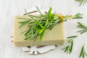 Homemade Coconut-Mint Soap Bar Topped with Sprigs of Mint and Rosemary | Vitacost.com/Blog