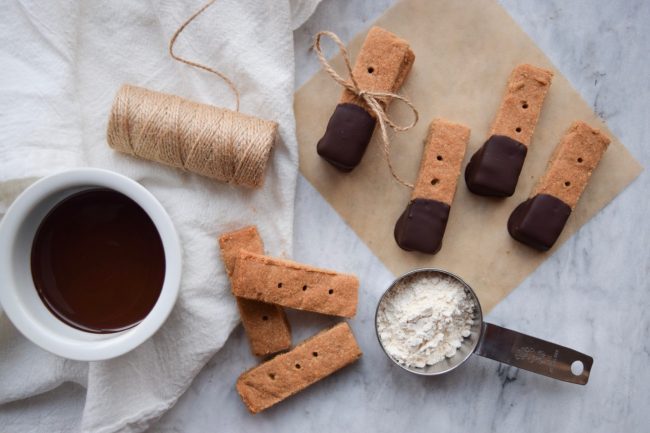 Create a Vegetarian Christmas in 5 Easy Steps Start Your Vegetarian Christmas with Homemade Graham Crackers Dipped in Chocolate on White Marble Counter | Vitacost.com/blog