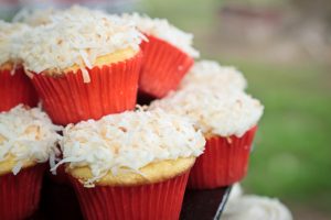 Coconut Cupcakes in Red Baking Cups Stacked on a Platter | Vitacost.com/blog