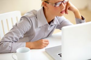 Woman With Bad Posture Slouching in Front of Laptop at Desk | Vitacost.com/blog
