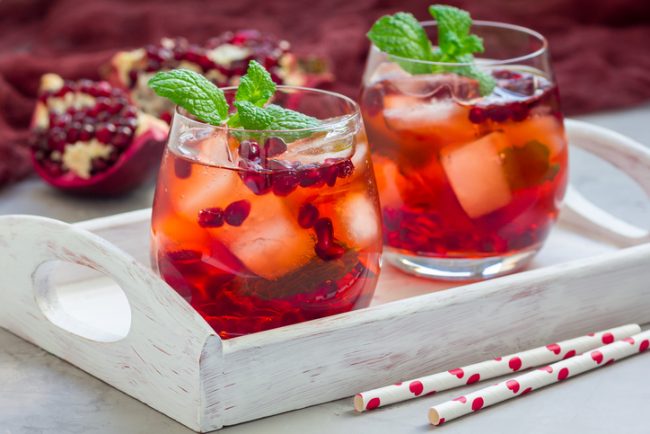 Minty Pomegranate Mocktail Recipe with Chia Glasses with Pomegranate Mocktail Garnished with Mint Leaves in Tray | Vitacost.com/blog