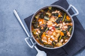 Kale and White Bean Soup in Pot with Ladle | Vitacost.com/blog