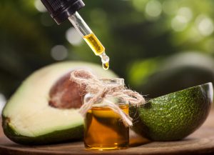 Avocado Slicked in Half with a Bottle of Essential Oil | Vitacost.com/blog