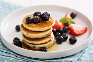 Baked Toddler Pancakes on a Plate with Maple Syrup and Berries | Vitacost.com/blog