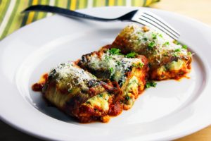 Three Eggplant Roll-Ups on a White Plate with Fork | Vitacost.com/blog