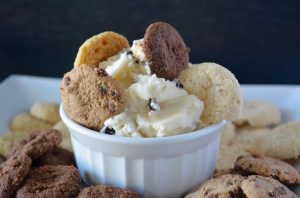 Chocolate Chip Cookie Dip in a White Ramekin with a Variety of Cookies Dunked into the Bowl # recipe| Vitacost.com/blog