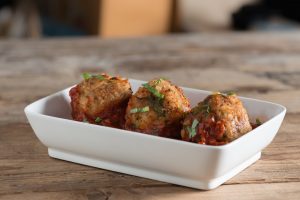 3 Turkey Zucchini Meatballs in a White Rectangular Serving Dish are Perfect for Meal Prep #recipe | Vitacost.com/blog