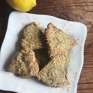 Lemon Poppy Seed Scones on a White Square Plate on Wood Table with Lemon Zest #recipe | Vitacost.com/blog