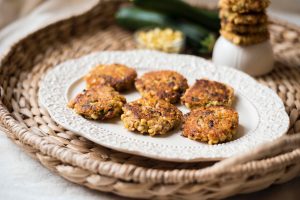 6 Tuna Cakes with Zucchini, Couscous & Corn on a White Plate #recipe | Vitacost.com/blog