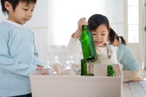 Children Learning to Protect the Environment by Recycling Glass Bottles | Vitacost.com/blog