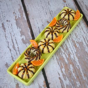 Green Platter of Almond Flour Orange Muffins with Chocolate Drizzle & Orange Slices | Vitacost.com/blog