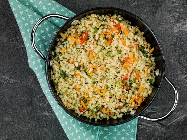 Low-Carb Recipe: Cauliflower Rice Pilaf | Vitacost Blog Cauliflower Rice Pilaf in a Skillet on a Green Napkin | Vitacost.com/blog