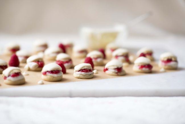 Healthy Raspberry Eclairs Recipe Bite-Sized, Healthy Raspberry Éclair Puffs on Parchment Paper #recipe | Vitacost.com/blog