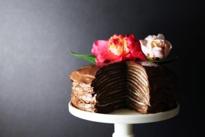 Homemade Paleo Chocolate Crepe Cake Garnished with Edible Flowers | Vitacost.com/Blog