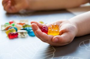 Child Holding Fiber Gummy Vitamins | Vitacost.com/Blog