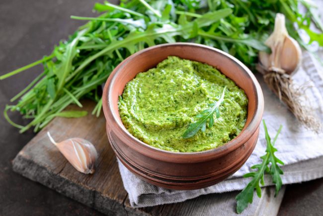 Arugula Pesto Recipe | Vitacost Blog  Arugula pesto in brown bowl | Vitacost.com/blog