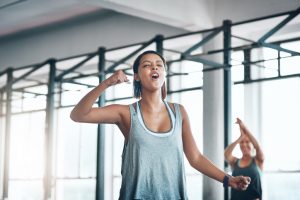 Woman Who Recently Fell in Love with Working Out Feeling Excited at Gym | Vitacost.com/Blog