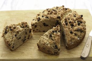 Gluten-Free Irish Soda Bread with Raisins on Wood, 2 Large Slices Cut #recipe| Vitacost.com/blog