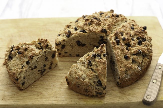 Gluten-Free Irish Soda Bread with Raisins  Gluten-Free Irish Soda Bread with Raisins on Wood, 2 Large Slices Cut #recipe| Vitacost.com/blog