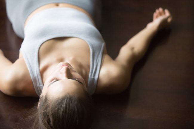 Woman Practicing Savasana During Yoga for Relaxation | Vitacost.com/Blog