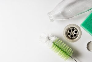 Sponge and Scrubber in Sink Simmering with DIY Non-Toxic Drain Cleaning Solution | Vitacost.com/Blog