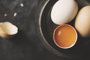 2 Whole Eggs & One Egg Yolk on Slate Counter Make You Wonder Are Egg Healthy? Learn the Truth | Vitacost.com/blog