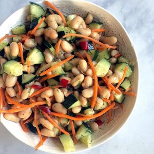 Bowl of White Bean Salad with Carrots, Cucumber & Red Bell Peppers #recipe | Vitacost.com/blog