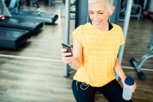 Middle-Aged Woman at Gym Enjoying the Benefits of Exercise to Fight Aging | Vitacost.com/blog