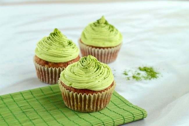Matcha Green Tea Cupcakes Recipe 3 Matcha Cupcakes with Matcha Green Tea Frosting on White Countertop #recipe | Vitacost.com/blog