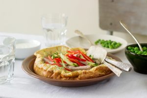 Dutch baby pancake with spring vegetables on table | Vitacost.com/blog