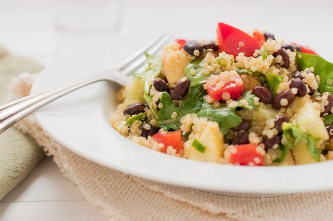 Black Bean & Arugula Tricolor Quinoa Salad Recipe  Quinoa Salad on Plate with Black Beans, Arugula and Veggies | Vitacost.com/blog